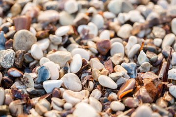Close up beach stones on the seashore. Summer sunrise on coast, Corfu island, Greece. Beach Ionian sea. Wallpaper