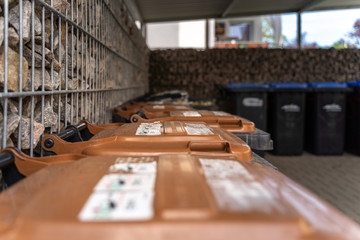 German waste separation. In the foreground organic waste, in the background paper waste