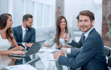 young businessman sitting at the office Desk