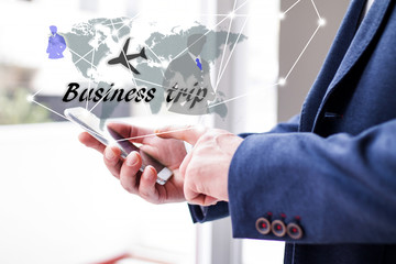 businessman choosing business trip from the mobile phone