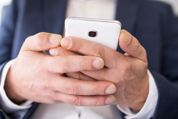 business man closeup with mobile phone