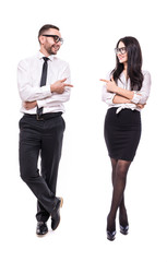 Young confident professional business colleagues pointing at each other, isolated on white background. Full height.