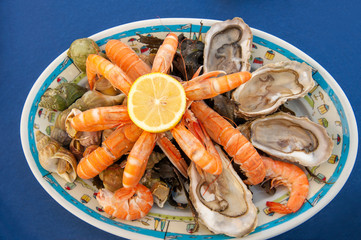 Plateau de fruits de mer, traditional French seafood plate of raw and cooked shellfish such as...