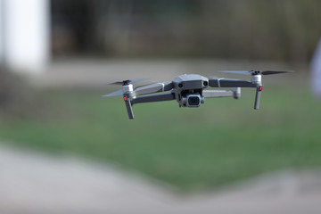 quadcopter flying in the air on the street