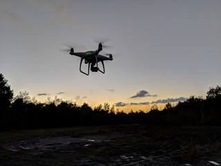 Fototapeta na wymiar Drone silhouette at sunset