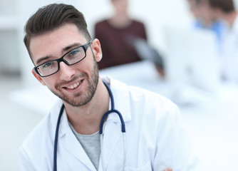 handsome doctor on blurred background