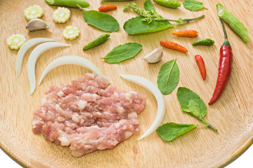 close up of Ingredient of Fried stir basil with minced pork on Wood tray  background, selective focus (detailed close-up shot)