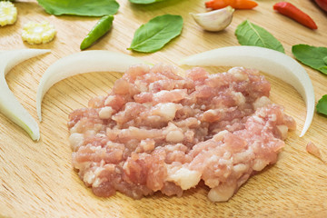 close up of Ingredient of Fried stir basil with minced pork on Wood tray  background, selective focus (detailed close-up shot)