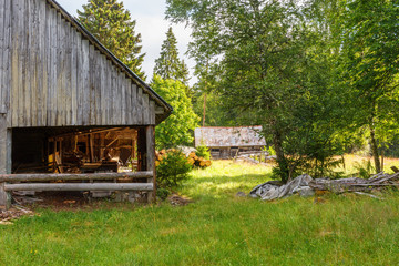 Old sawmill with timber and a shed