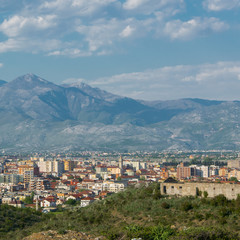 Fototapeta na wymiar Albanian city Shkoder cityscape with mountain background