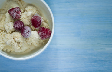  homemade ice cream with frozen cherry and raspberry .   healthy sweets concept
