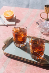 Negroni, an Iba cocktail, with 1/3 gin, 1/3 bitter, 1/3 vermut, in luxury pop style, rich and colorful.