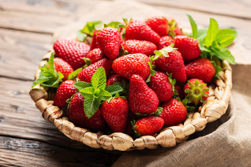 Summer sweet red strawberry on the wooden table