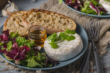 Grilled camembert cheese with honey