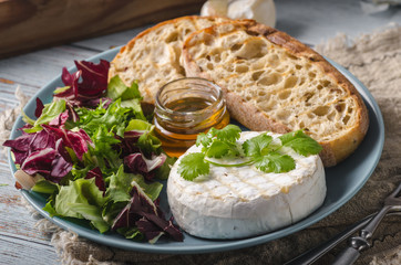 Grilled camembert cheese with honey