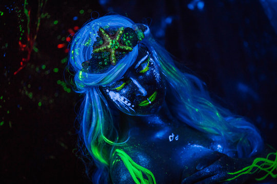 Portret Of Water Woman.  Body Art Glowing In Ultraviolet Light. Neon