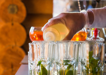 hand of barman preparing cocktail