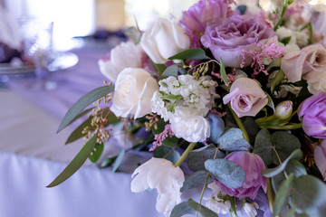 Table of a groom and a bride. Wedding floristics with emphasis on lilac flowers
