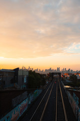 Fototapeta na wymiar Melbourne CBD skyline with railroad track morning view with cloudy sky.