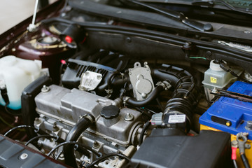 Hood of the car. auto repair car. Parts and engine under the hood