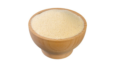 semolina in wooden bowl isolated on white background. nutrition. food ingredient.