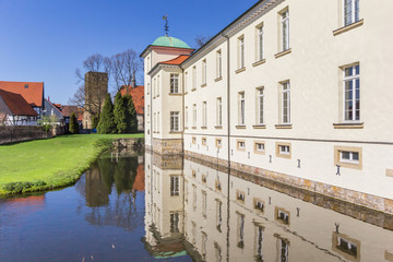 Castle Westerholt with reflection in the water in Germany