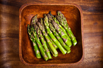 raw green asparagus in wooden rustic box like green vegetables concept 