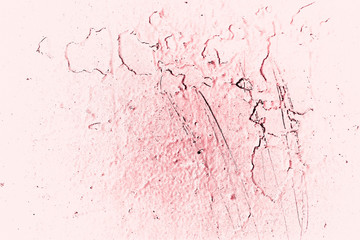 Vintage pink background. Rough painted wall of fiesta color. Imperfect plane of rosy colored. Uneven old decorative toned backdrop of rouge tint. Texture of pink hue. Ornamental stony surface.
