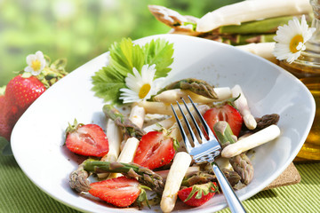 Asparagus salad with strawberries, copy space
