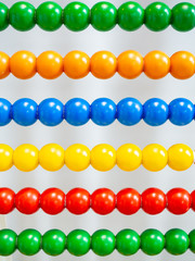 20th-century abacus with colored balls background