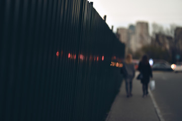 skew metal fence in a disadvantaged area city