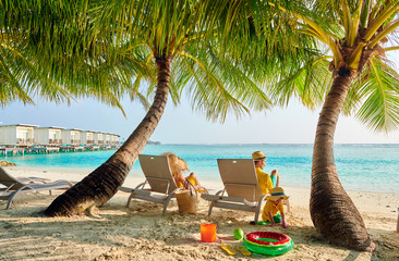 Family with three year old boy on beach
