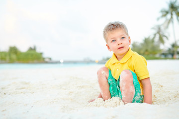 Three year old toddler boy on beach