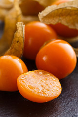 juicy winter cherry on a dark stone background