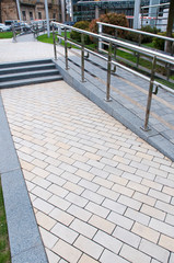 railing and pavement in recreation areas and near architectural buildings
