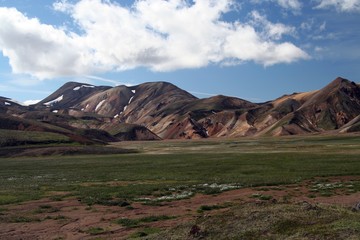 Hiking along a bizarr sharp colorful rock formation at Landmannalaugar, Iceland
