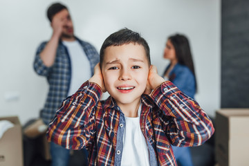 Small boy listening quarrel between parents!