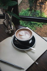 cup of coffee on table in cafe