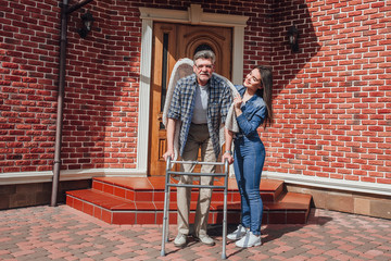 Senior man with her   daughter at home! Beautiful day!