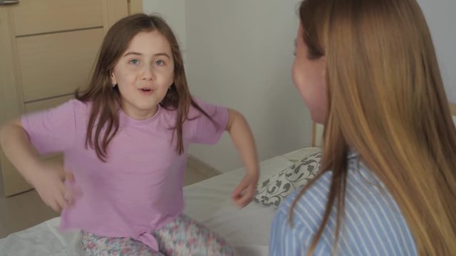 girl shows a monkey
