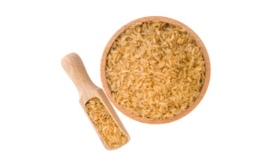 brown rice in wooden bowl and scoop isolated on white background. nutrition. bio. natural food ingredient.top view.