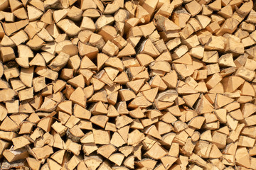 A woodpile of fresh, natural freshly cut and chopped wood.