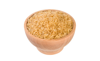 brown rice in wooden bowl isolated on white background. nutrition. food ingredient.