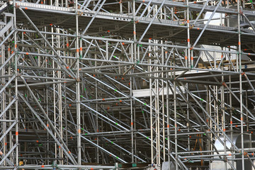 metal prefabricated structures / abstract background metal beams and pipes in prefabricated industrial structures, construction of temporary structures