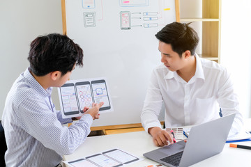 Graphic designers creative drawing website ux app development and application for mobile phone in the office.