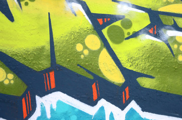 Fragment of colored street art graffiti paintings with contours and shading close up