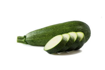 Fresh cut zucchini isolated on a white background. Design element for product label. Design image of fresh whole zucchini. Green zucchini vegetables isolated on white.