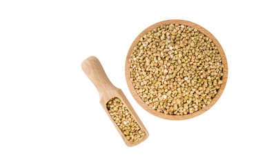 raw buckwheat in wooden bowl and scoop isolated on white background. nutrition. bio. natural food ingredient.top view.
