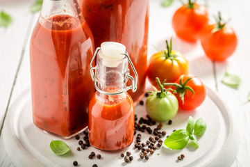 Closeup of homemade and tasty ketchup prepared from tomatoes