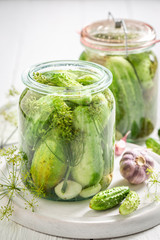 Closeup of preparation for canned green cucumber in the jar